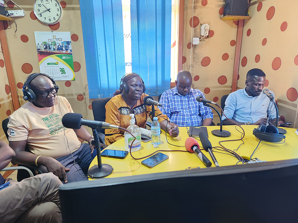 Local Government Minister Balaam Barugahara (2nd right) during a talk show on Pakwach FM, where he said his visit to the district was aimed at addressing challenges affecting residents rather than receiving praise. (Courtesy)