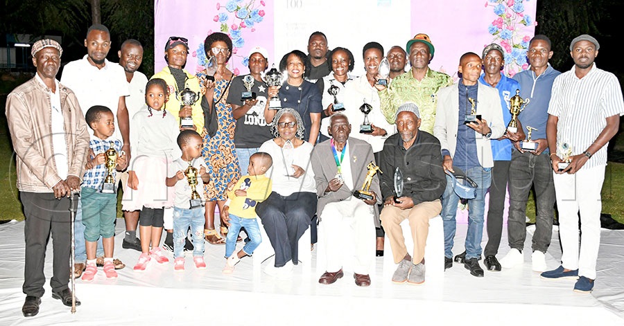 The different winners pose with Mzee Basaliza (seated-center) after the Centennial Golf Tournament in his honour at Tooro Club, December 20, 2025. Photo by Michael Nsubuga