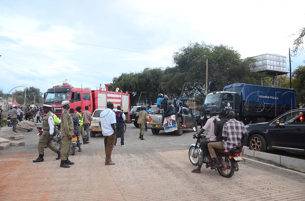 The security used police trucks and vehicles to block FDC supporters from accessing presidential candidate Nandala Mafabi in Moroto municipaity. (Photo by Isaac Nuwagaba)