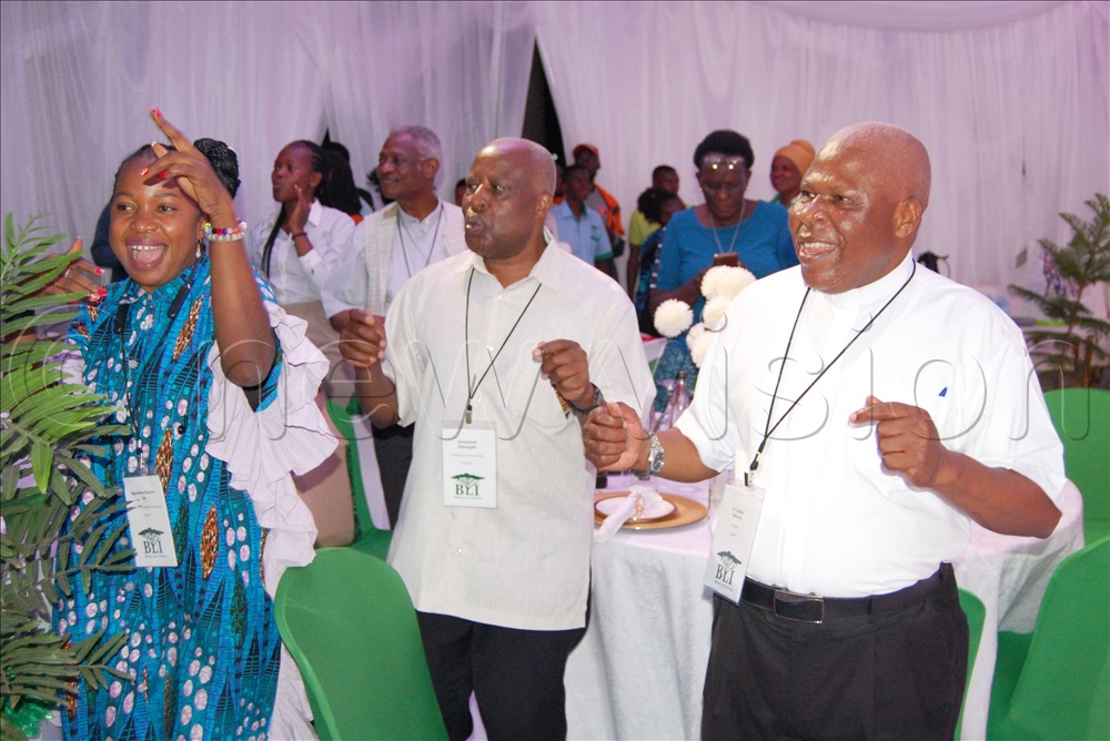 The President of BLI, Fr Prof. Emmanuel Katongole ( second-left), the Director Fr Joseph Kakooza Nnyanzi (right) and other delegates dancing in celebration of the successful conclusion of the conference.