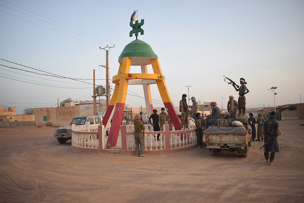 Tuareg rebels of the Azawad Liberation Front (FLA) coalition gather at the Kidal roundabout in Kidal, on April 26, 2026. April 25, 2026's shock attacks, synchronised by Tuareg rebels of the Azawad Liberation Front (FLA) coalition and the jihadist Group for the Support of Islam and Muslims (JNIM), targeted several areas in the vast arid country. (AFP)