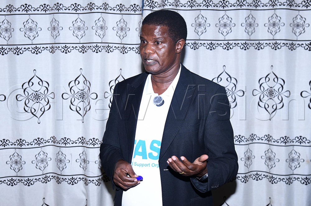 TASO Soroti Centre Programmes Manager Charles Odoi addresses the NSSF team during a meeting at the TASO boardroom in Soroti City. (Credit: Godfrey Ojore)