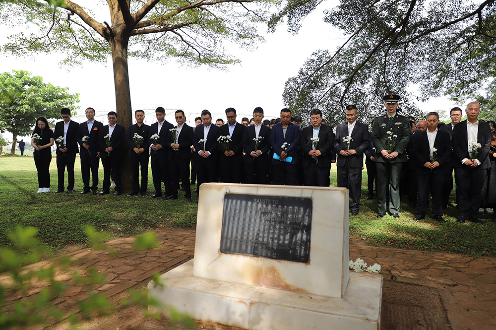 A team from the Chinese Embassy in Uganda holding a memorial at the China Experts Monument, Namboole, Kampala, on Friday, April 3. (Courtesy: Chinese Embassy)