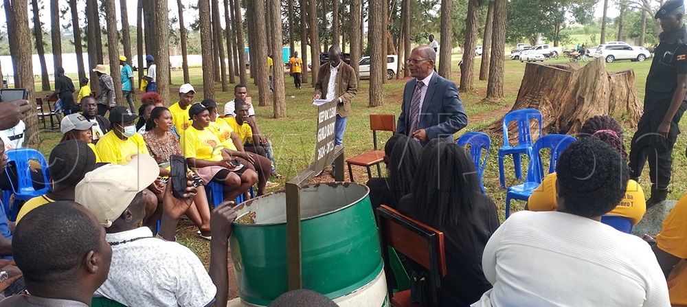 Dr John C. Muyingo, State Minister for Higher Education, in a lengthy last-minute meeting at the venue where campaign will take place. (Credit: Frederick Kiwanuka)
