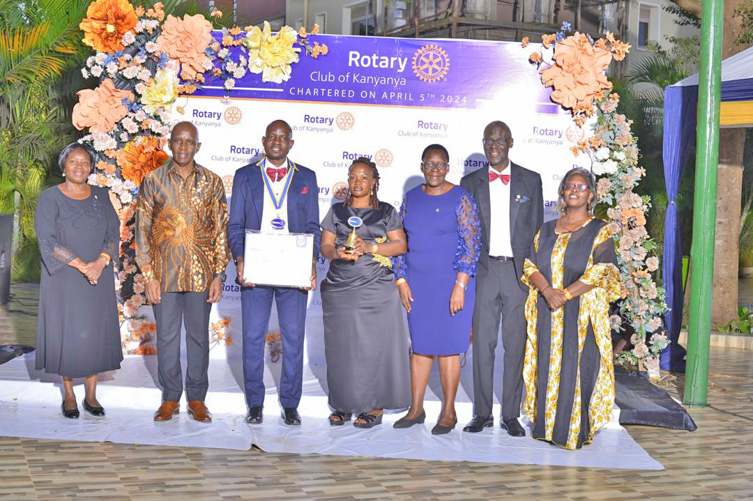 (L-R) Assistant Governor (AG), Mildred Bahemuka, Past District Governor (PDG), John Magezi Ndamira, President Dan Mazinga, Mrs Mazinga, AGE Martha Erimu, Charter President (CP), Ronald Ngobya Mukasa and Assistant Governor (AG), Evelyn Bahemuka during installation of the Rotary Club of Kanyanya president at Greenfield Gardens in Kanyanya.