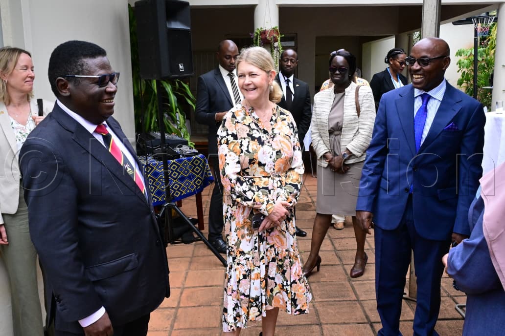 Minister for Justice and Constitutional Affairs, Norbert Mao, the Ambassador of Sweden to Uganda, H.E. Maria H&aring;kansson, and Chief Justice, Dr Flavian Zeija, having a light moment.