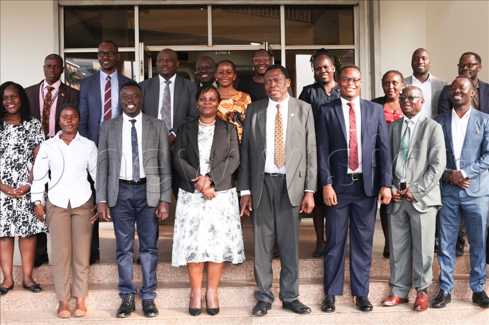 Ministry of Health officials and Partners pose for a photo after the handover of the boxes of glasses.
