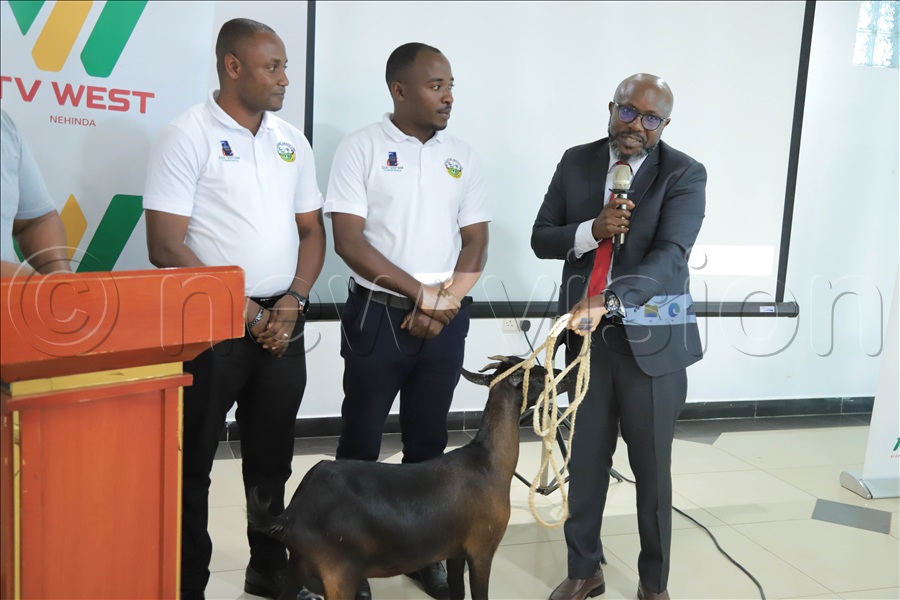 Vision Group Chief Executive Officer, Don Wanyama, receives a gift (goat) from Nyakayojo SACCO as an appreciation for what Vision Group, through TV West And Radio West, has done for them.