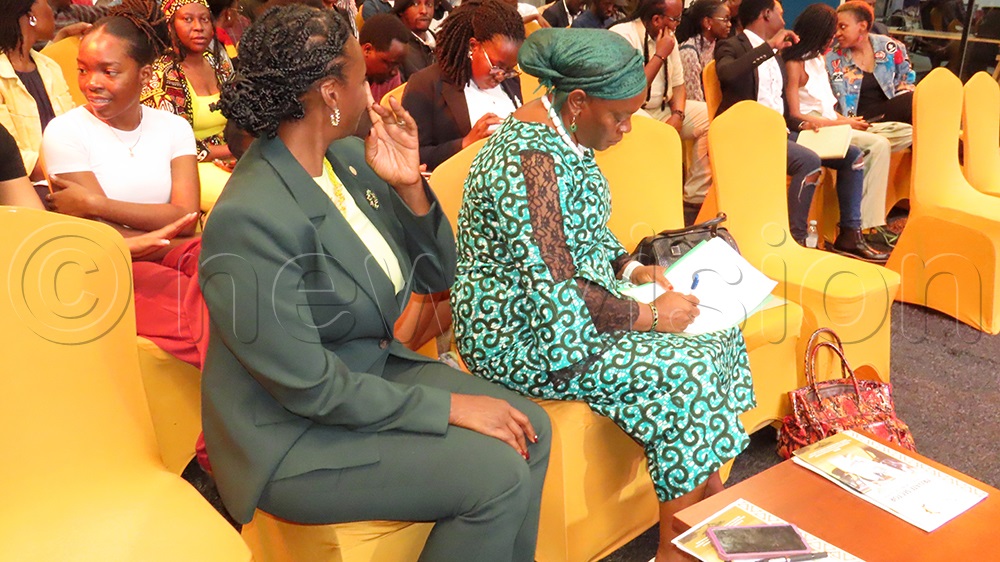 Minister of  Gender, Labour and Social Development, Peace Mutuuzo, listens to the plight of artists at MoTIF. (Credit: Titus Kakembo) 