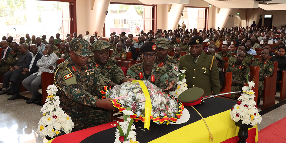 Senior UPDF officers lay a wreath on the casket to honour Maj. Gen. Francis Takirwa during the funeral service at All Saints Cathedral, Nakasero, on Feb. 11, 2026. (Courtesy)