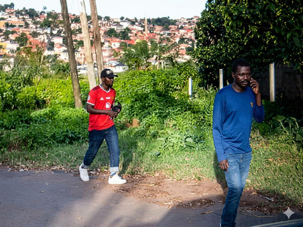 The two suspects still at large were captured on camera after robbing a Chinese national in Lubowa. (Courtesy)