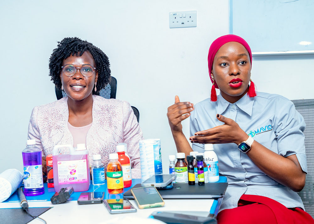 Dr. Aisha Bukenya (right) briefs State Minister for Investment Evelyn Anite on the range of products manufactured at the Mavid Pharmaceuticals plant in Kajjansi, along Entebbe Road in Wakiso, during the minister’s visit on Thursday. Dr. Bukenya praised the National Drug Authority (NDA) for its support in helping the company meet high standards, but noted that the high cost of importing raw materials remains a major challenge. (Courtesy Photo)
