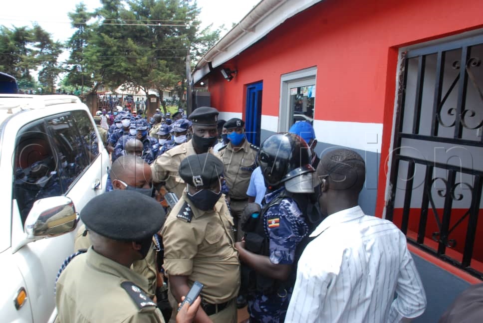 Police officers at NUP offices in Kamwokya on Wednesday. Photos by Simon Peter Tumwine