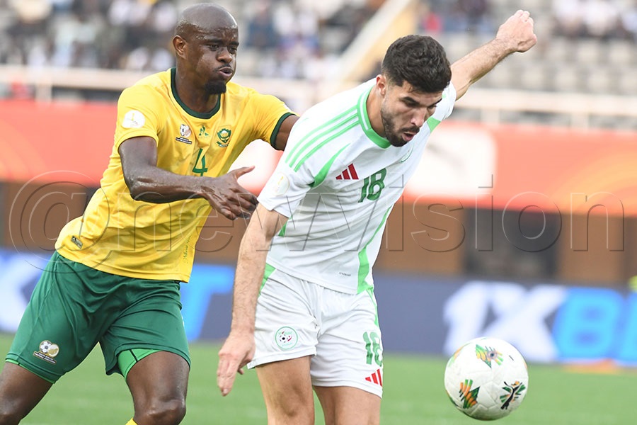 Algeria's Aimen Ahious (right)  beats South Africa 's Kwandakweswiza Mngonyama during a CHAN Group C match at Namboole, August 8 2025.  Photo by Michael Nsubuga