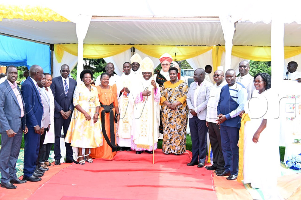  Vice President Jessica Alupo poses for a photo with prelates after the ordination of Fr. Olupot. (Credit by Delux Emmy Alomu)