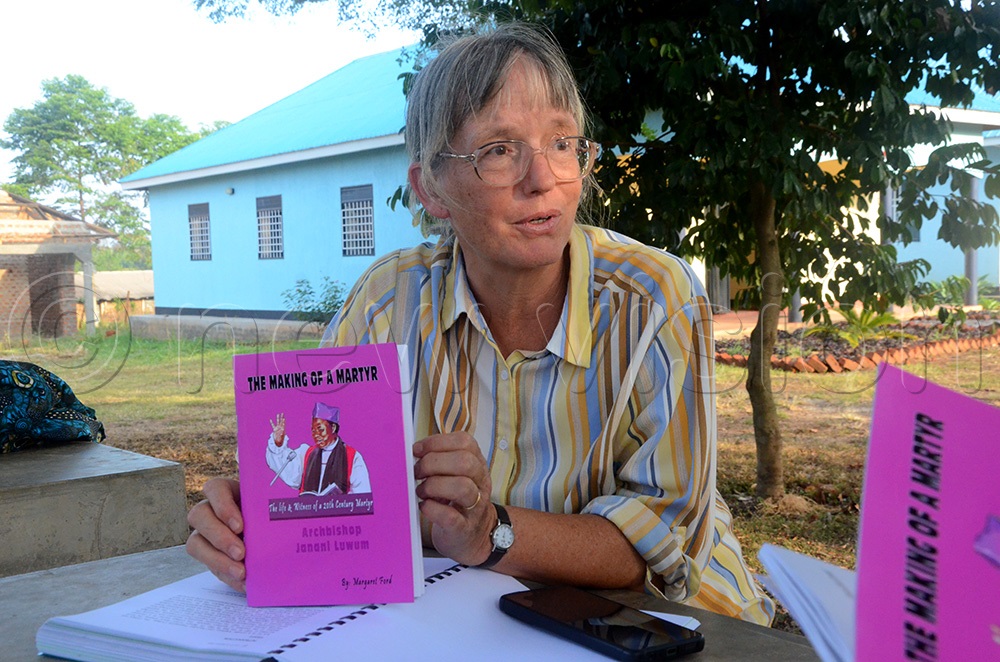 Principal Rev Sarah Cawdell showing the book (The making of a Martyr) written by Margaret Ford, a missionary and a former Secretary to Bishop Janani Luwum and later Archbishop. (Photo by Rosemary Anena)