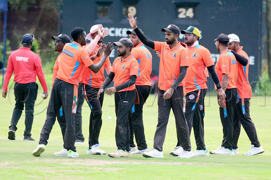 GM Sugar's players celebrate the fall of a wicket against the Tornado Bees' during a league match at the Lugogo Cricket Oval, April 19, 2026. GM Sugar won by 4 wickets. Photo by Michael Nsubuga