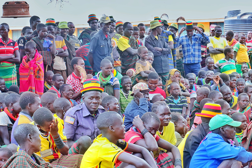 Community members waiting for their names to be called during the launch of relief food distribution in Kabong district. (Courtesy photo)