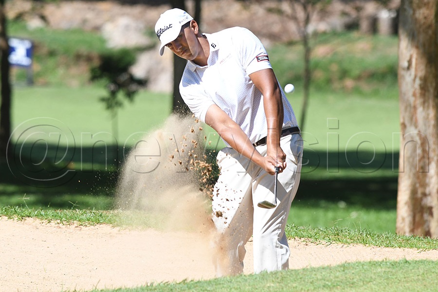 2024 winner Zambian Dayne Moore chips from a bunker on hole 17. Photo by Michael Nsubuga