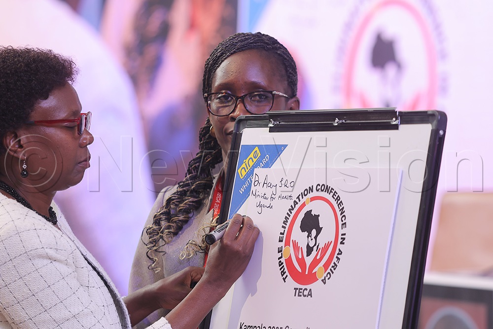 Minister of Health, Dr Jane Ruth Aceng signing on the call to action. (Credit: John Musenze)