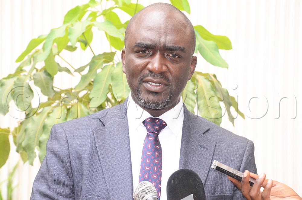 The KCCA Spokesperson, Daniel Muhumuza Nuweabaine, speaking on the plans to relocate abandoned market stalls to stranded street hawkers and new traders. (Credit: Isaac Nuwagaba)