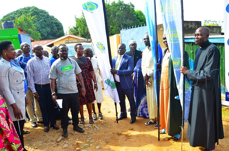 Arua RCC Salim kumakech in suit and religious leaders flagging off the donated items to Rhino Camp Refugee Settlement. (Photo by John Paul Opio)