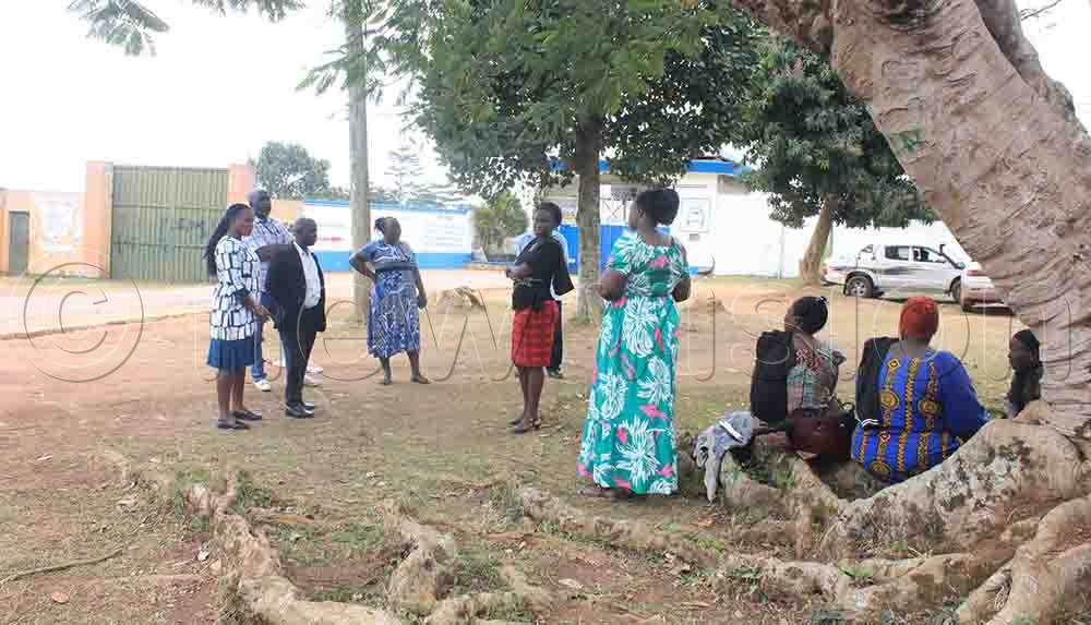 Some of the parents storm outside the school as a sign of protest for the indefinite suspension of their children. (Credit: Henry Nsubuga)
