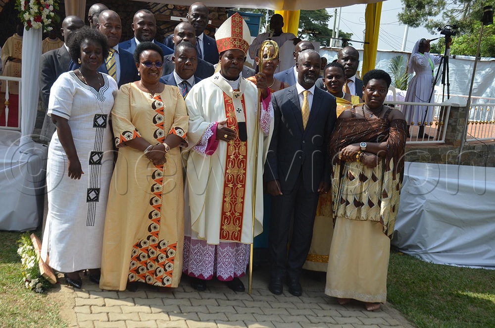 The Archbishop of Mbarara Archdiocese, His Grace Lambert Bainomugisha and Deputy Speaker of Parliament Thomas Tayebwa posing for the photo with MPs who attended the ordination ceremony on Saturday at Nyamitanga Cathedral in Mbarara city. (Photo by Abdulkarim Ssengendo)