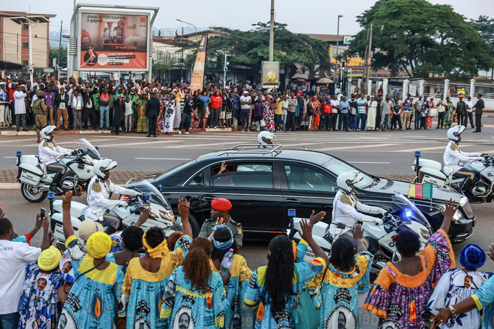 President of Cameroon Paul Biya's motorcade is greeted by supporters as it passes through Yaounde on August 20, 2026, after his arrival back in Cameroon following a 73-day absence.