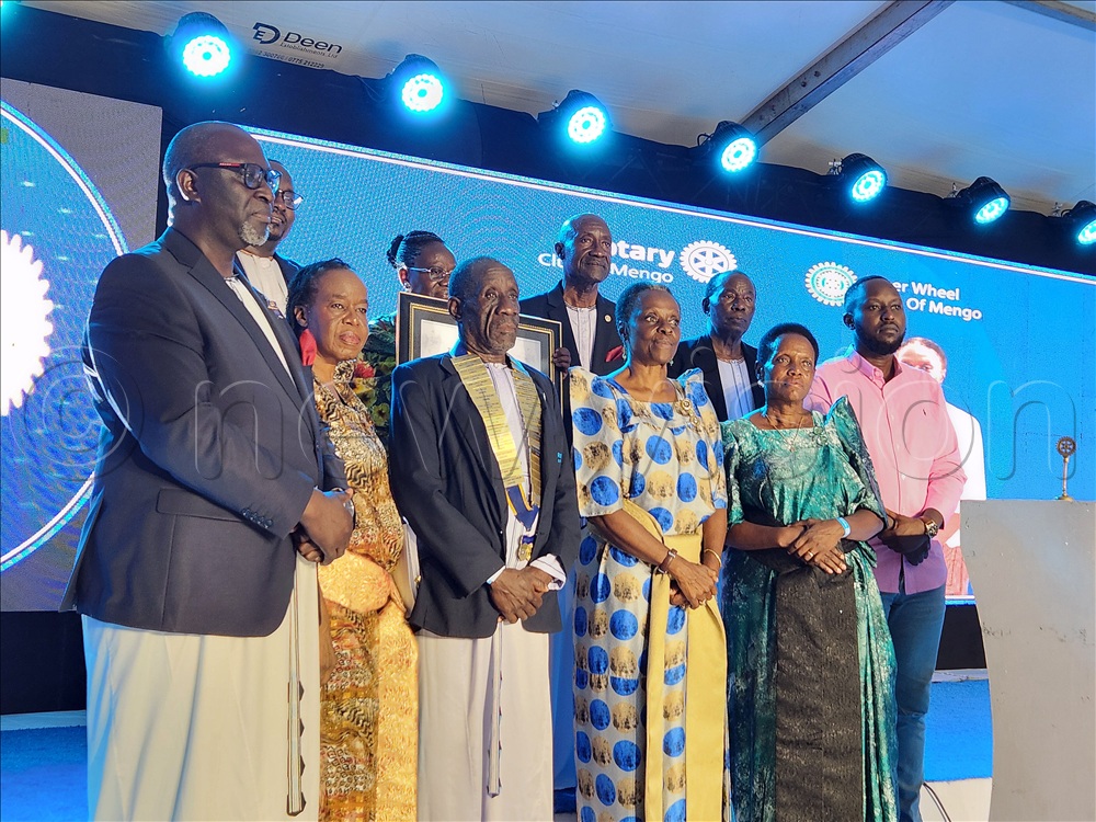 Buganda Kingdom princess Nnaalinnya Dr. Catherine Agnes Nabaloga (fourth from Left) posing for a picture with Rotarians and other guests after she was inducted an honorary member of the Rotary club of Mengo. This was during the double installation ceremony of the new president of the Rotary Club of Mengo and the president of the Inner Wheel Club of Mengo held at Pope Paul Memorial Hotel in Kampala on May 17, 2026.