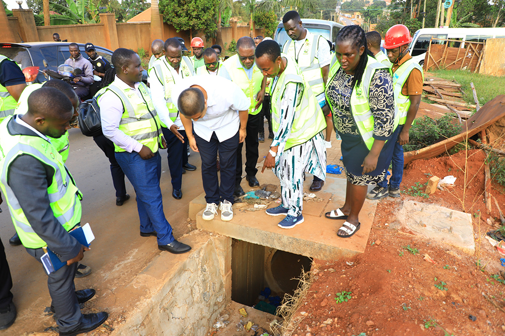 Members of Parliament of Uganda inspecting Kira road works in Wakiso district on February 3. (Courtesy photo)