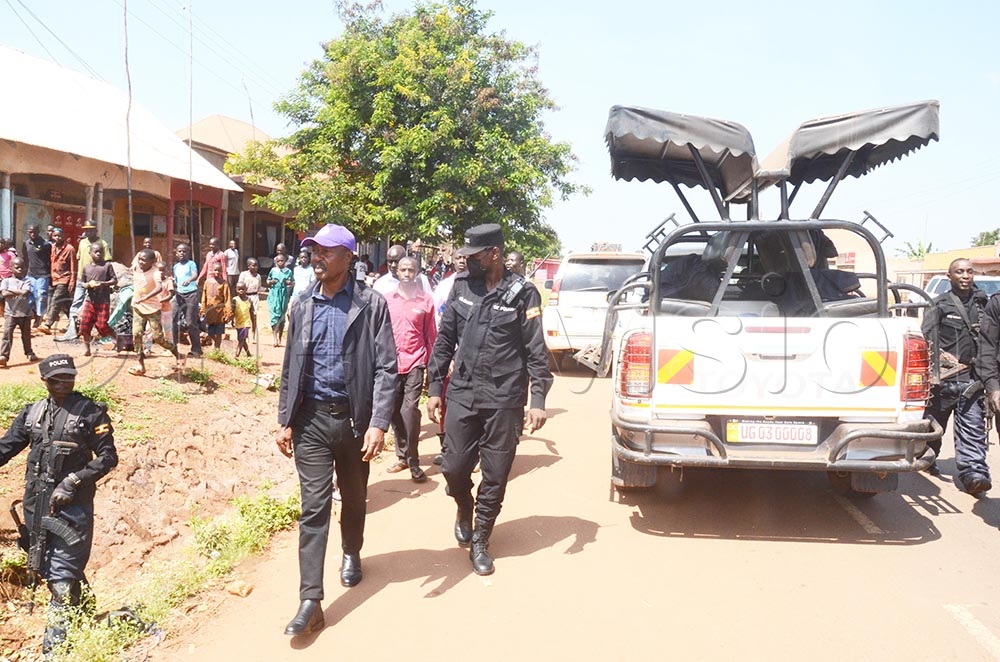 Some of the presidential candidate's guards escorting Maj Gen Mugisha Muntu while conducting his campaigns in Kayunga district last year. (Credit: Isaac Nuwagaba)
