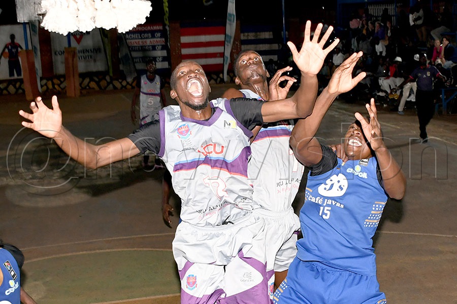 UCU Canons' Chiedozie Raluchukwu (left) and Kayiira Joel (center) fight for a rebound wth City Oilers Bolton Rujumba during an NBL match at YMCA, May 16, 2025. UCU Canons won 79-62. Photo by Michael Nsubuga