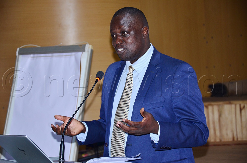 The Uganda AIDS Commission (UAC) Director Partnerships Tom Etti addressing Seventh-Day Adventist leaders during the meeting. (Photo by Agnes Kyotalengerire)