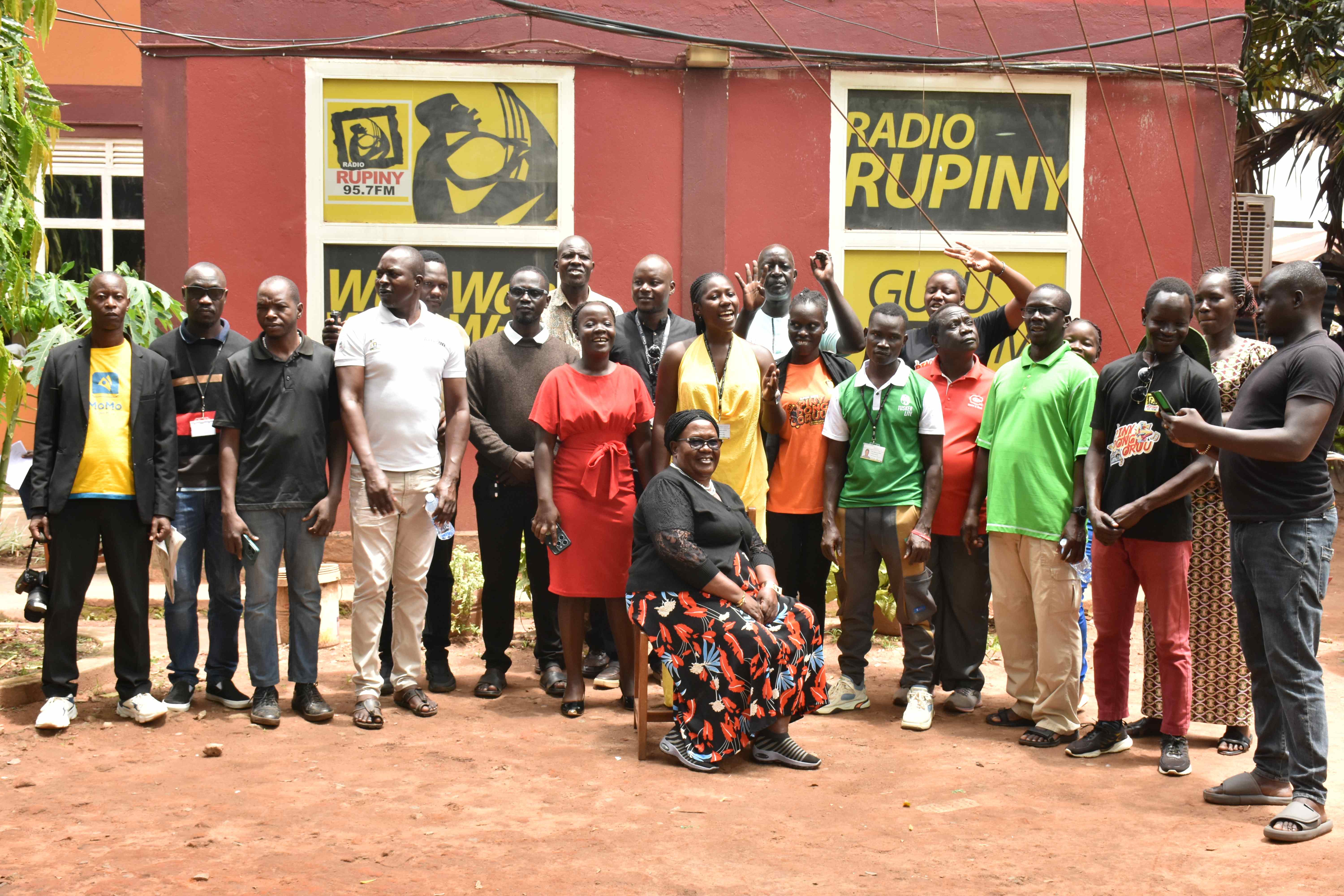 Vision Group staff in Gulu city pause for photo after prayers.