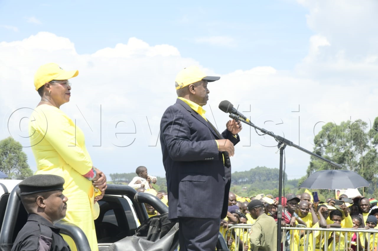 Former Prime Minister Amama Mbabazi addressing NRM supporters as speaker of parliament, Anita Among, looks on during the rally in Kanungu. (Credit: Eddie Ssejjoba)