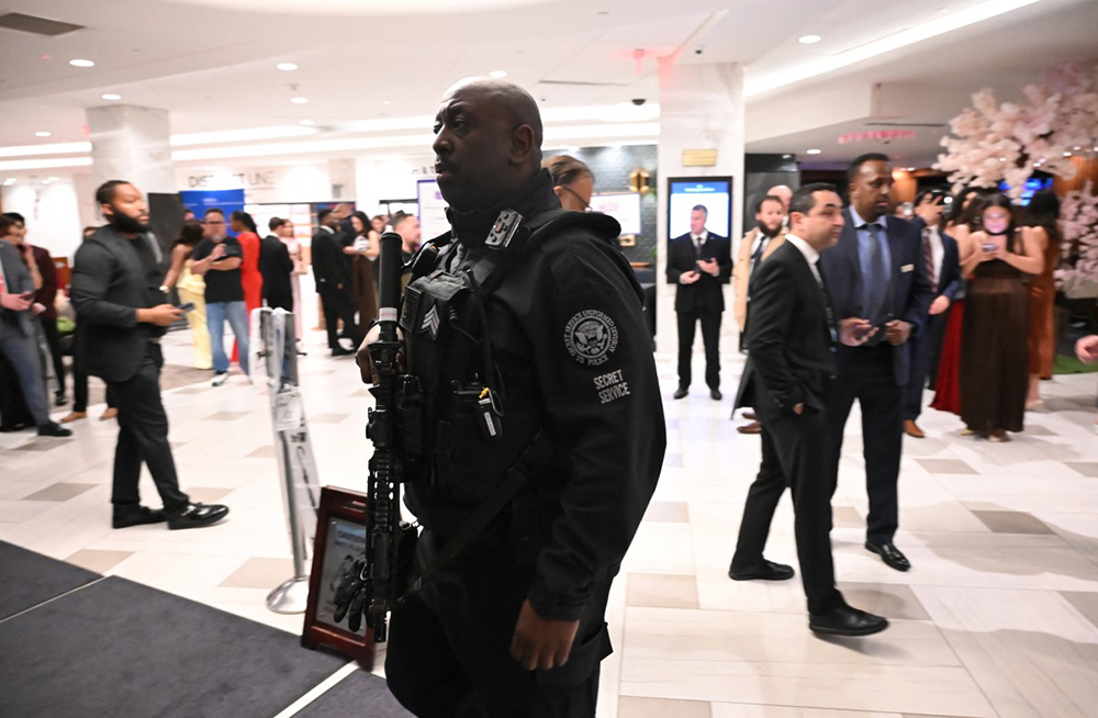 A Secret Service officer walks through the lobby of the Washington Hilton after shots were heard during the White House Correspondents' Dinner in Washington, DC, on April 25, 2026. 