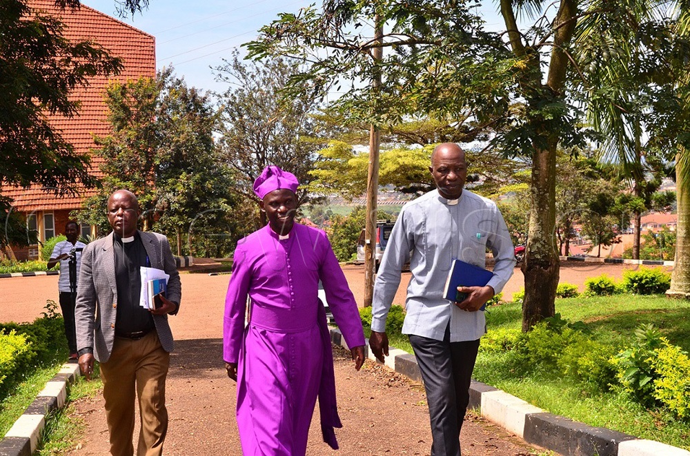 Busoga Diocese Secretary Can. Aggrey Kasadha (L) flanked by Bishop Grace Lubaale (C) together with the land and estates officer Can. Charles Irongo at Christ's Cathedral Bugembe in Jinja city recently. (Photo by Jackie Nambogga)