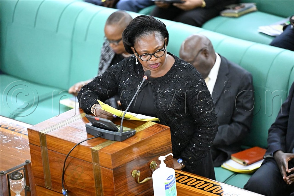 State Minister for Lands Harriet Ntabazi presents a statement before parliament on the temporary suspension and review of issuance of special titles in Uganda.