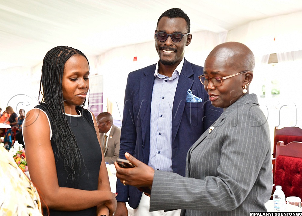 L-R: Carol Kagezi and George Philip Kagezi Kulubya with Principal Judge Lady Justice Jane Frances Abodo sharing a light moment during the 8th Joan Kagezi memorial lecture at Speke Resort hotel in Munyonyo on Friday 29th May 2026. (Photo by Mpalanyi Ssentongo)