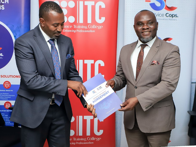 L-R: Kamugasho of Services Cops and Sseremba of ITC pose with the signed documents. (Courtesy)