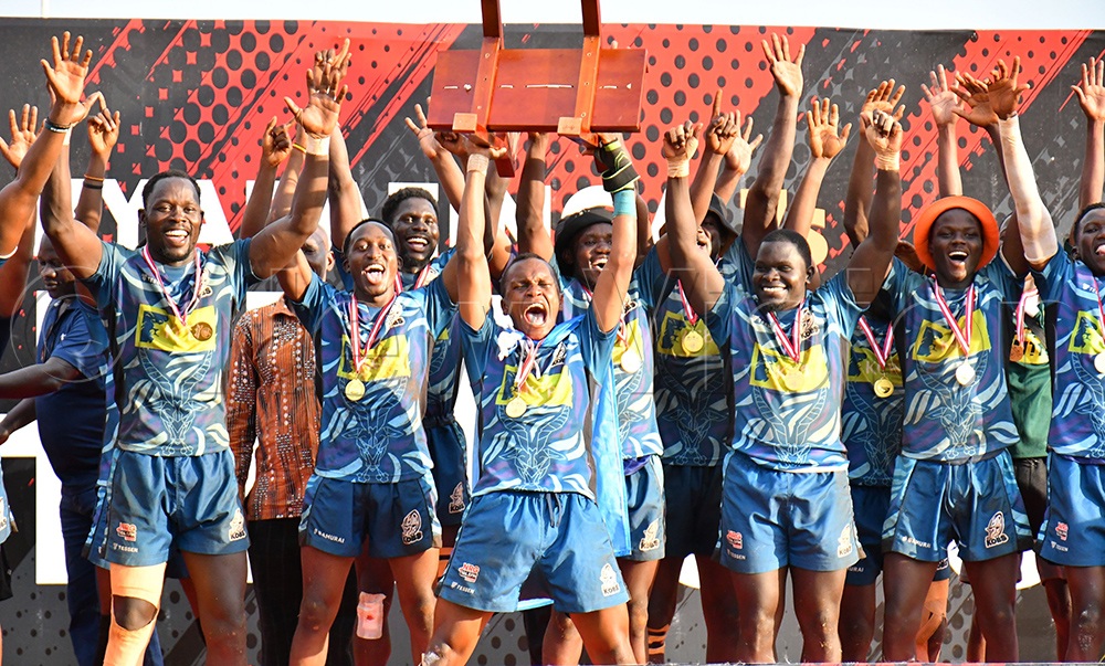 KCB Kobs jubilating with their trophy after emerging as winners of the Kyabazinga Sevens at Kyabazinga stadium in Bugembe on Sunday. They beat Rams 22-19. (Credit: Donald Kiirya)