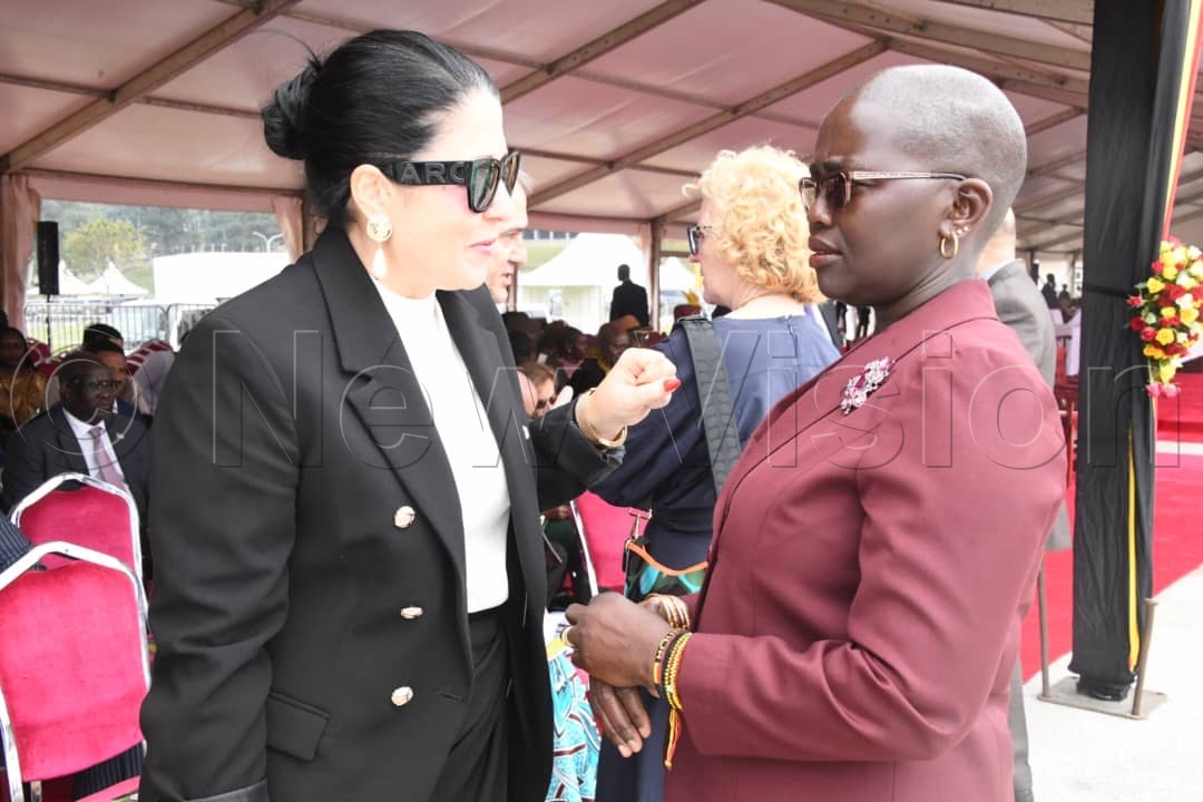 Lady Justice Jane Frances Abodo (right) interacting with a diplomat at the independence day celebrations.