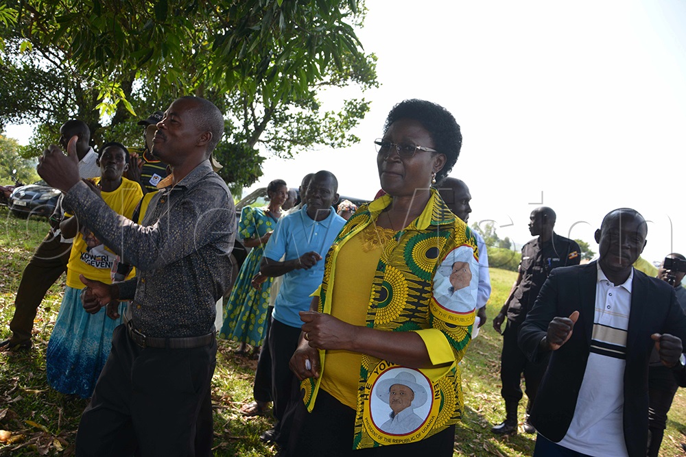 Dr Rosemary Nansubuga Sseninde, NRM director of mobilisation, dancing with NRM village leaders in Karama village in Buhimba sub-county. (Photo by Peter Abaanabasazi)