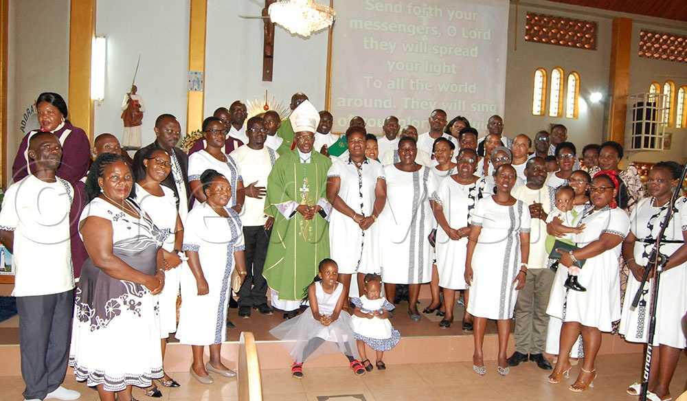Nuncio Augustine Kasujja (wearing a mitre and a green chasuble) shares a photo-moment with the Catholic professionals during their empowerment mass at St. Charles Lwanga Catholic parish church Ggaba, in Makindye Division on Sunday, September 21, 2025. (Credit: Mathias Mazinga)