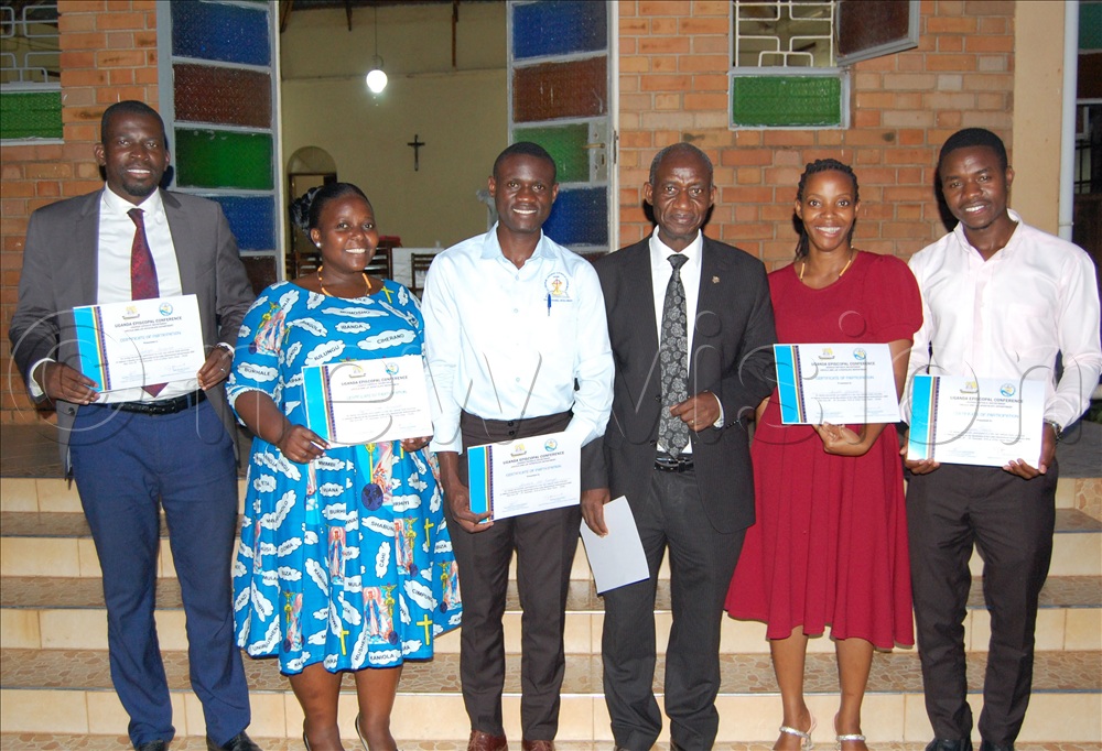 The Head of the Laity in Uganda, Gervase Ndyanabo (fourth-left) shares a photo moment with some youthful participants after the study workshop.