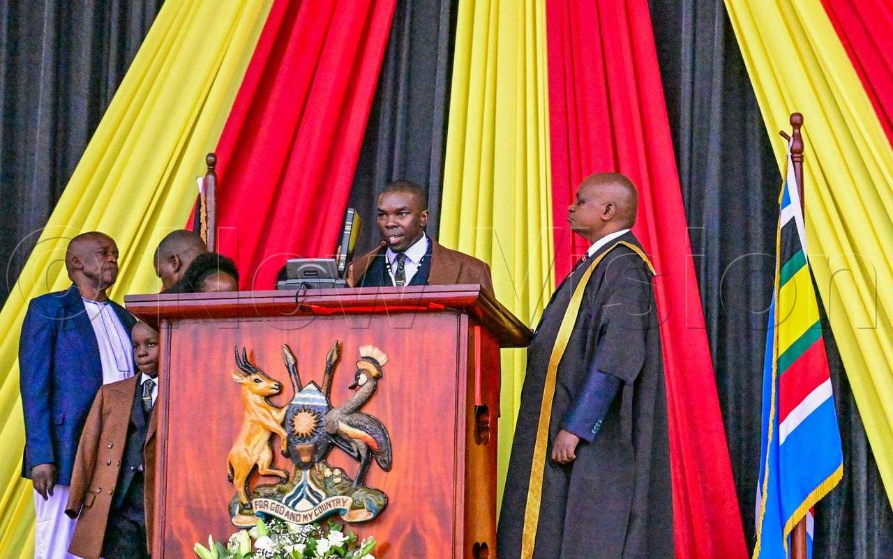 Erick Lule Eria, surrounded by family, takes oath. (Photo by Miriam Namutebi)