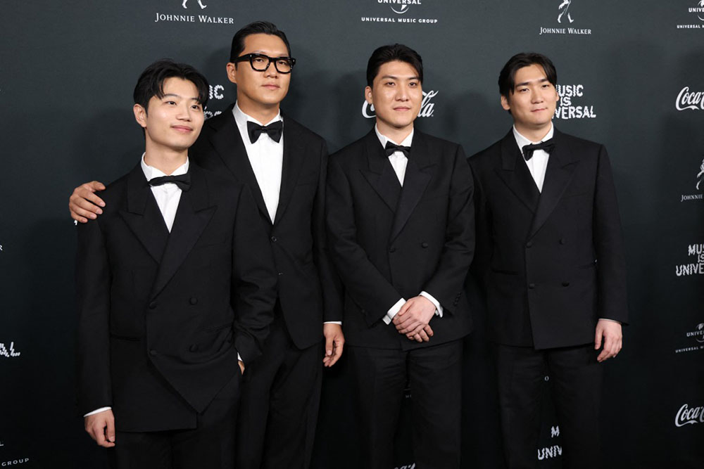 (L-R) "KPop Demon Hunters" soundtrack writers DemonYu Han Lee, Jeong Hoon Seo, Joong Gyu Kwak and Hee Dong Nam attend Universal Music Group's Grammy after party at Nya Studios West in Los Angeles on February 1, 2026. (Credit: AFP)