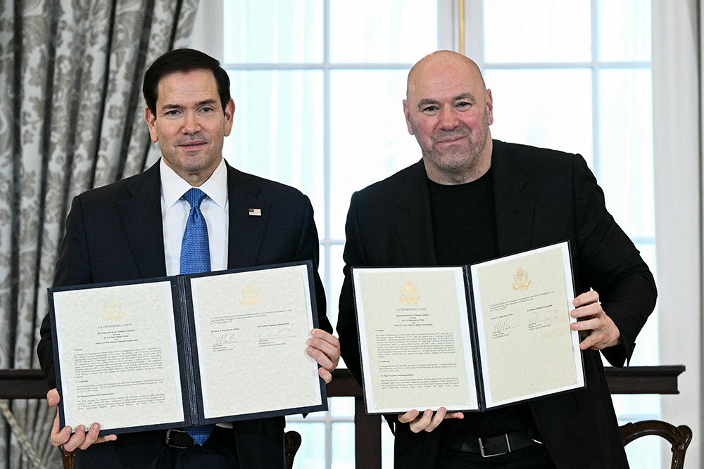 (L/R) US Secretary of State Marco Rubio and UFC President and CEO Dana White participate in a Memorandum of Understanding signing ceremony at the State Department in Washington, DC, on June 11, 2026.