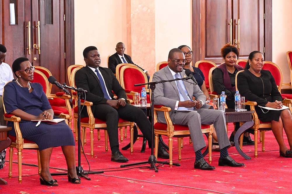  The CDC Director General of Africa Dr. Jean Kaseya (C) and his delegation during a meeting with President museveni at State House Entebbe on Friday. (L) is Ministry of Health PS Dr. Diana Atwine. PPU Photo.